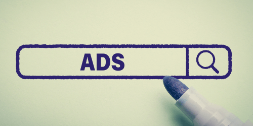 An image of a search bar drawn on, with 'ADS' written inside and a felt pen hovering over.