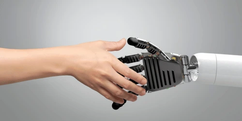 A human hand shaking a robot hand, representing the relationship between humans and AI.